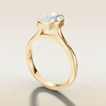 Pear Full Bezel Cathedral engagement ring in yellow gold, angled side view