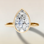 Pear Full Bezel Cathedral engagement ring in yellow gold, top view