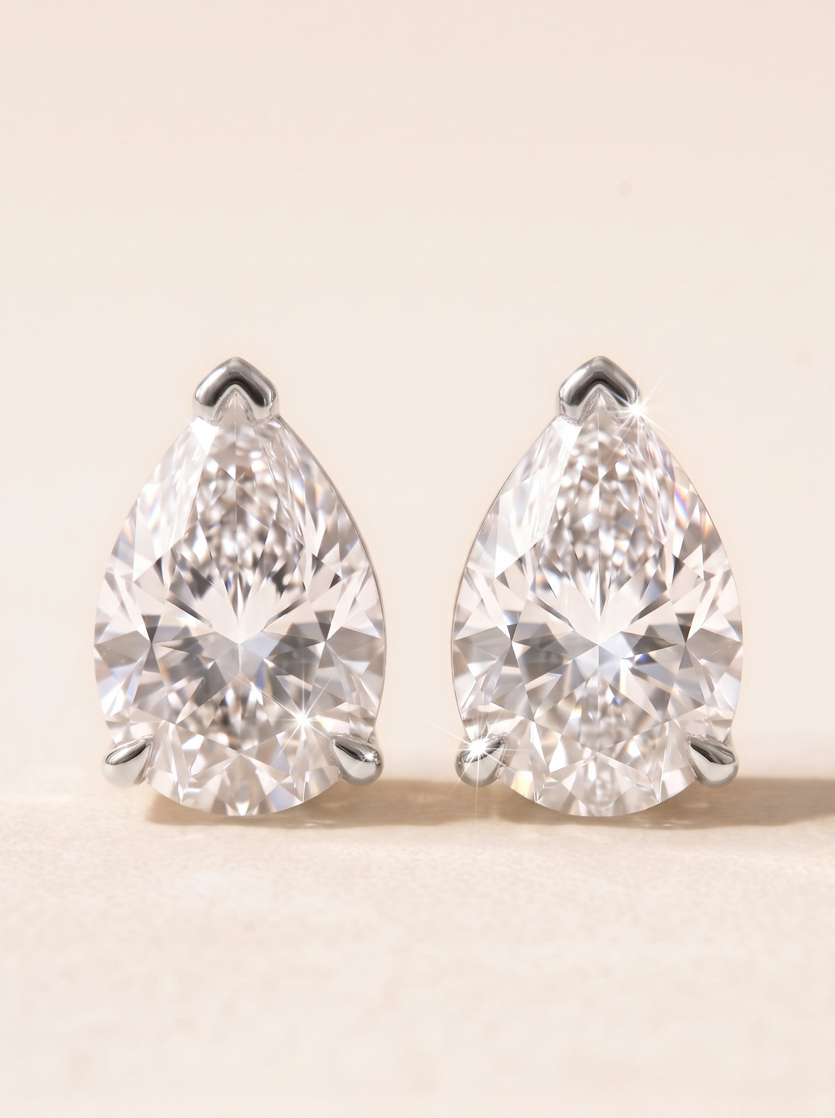 Pear diamond stud earrings in 14K white gold