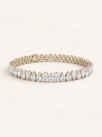 Pear shaped diamond tennis bracelet in 14K yellow gold