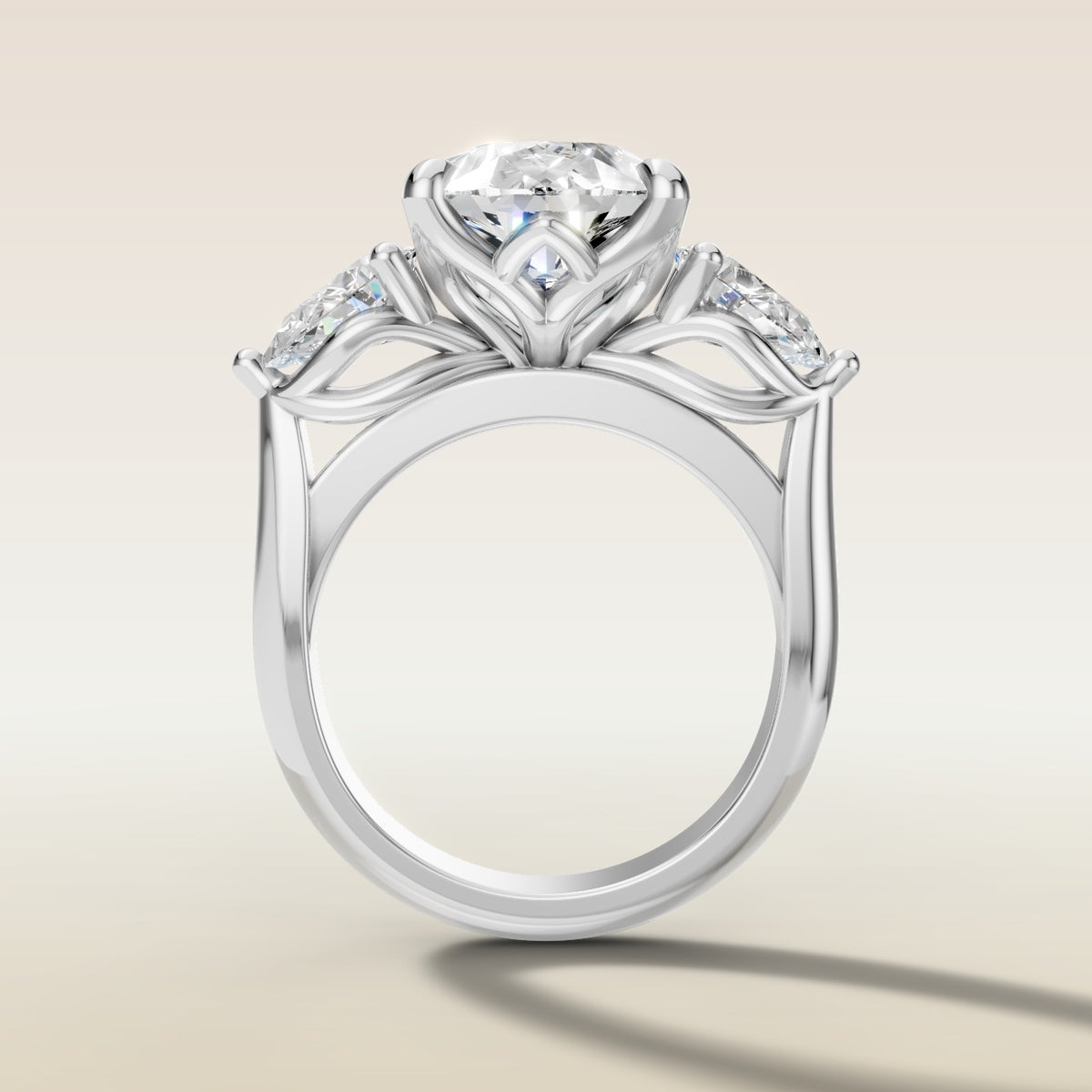 Pear Tulip Three Stone Diamond Bridge engagement ring in white gold, front view