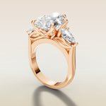 Pear Tulip Three Stone Diamond Bridge engagement ring in rose gold, angled side view