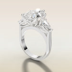Pear Tulip Three Stone Diamond Bridge engagement ring in white gold, angled side view
