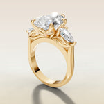 Pear Tulip Three Stone Diamond Bridge engagement ring in yellow gold, angled side view