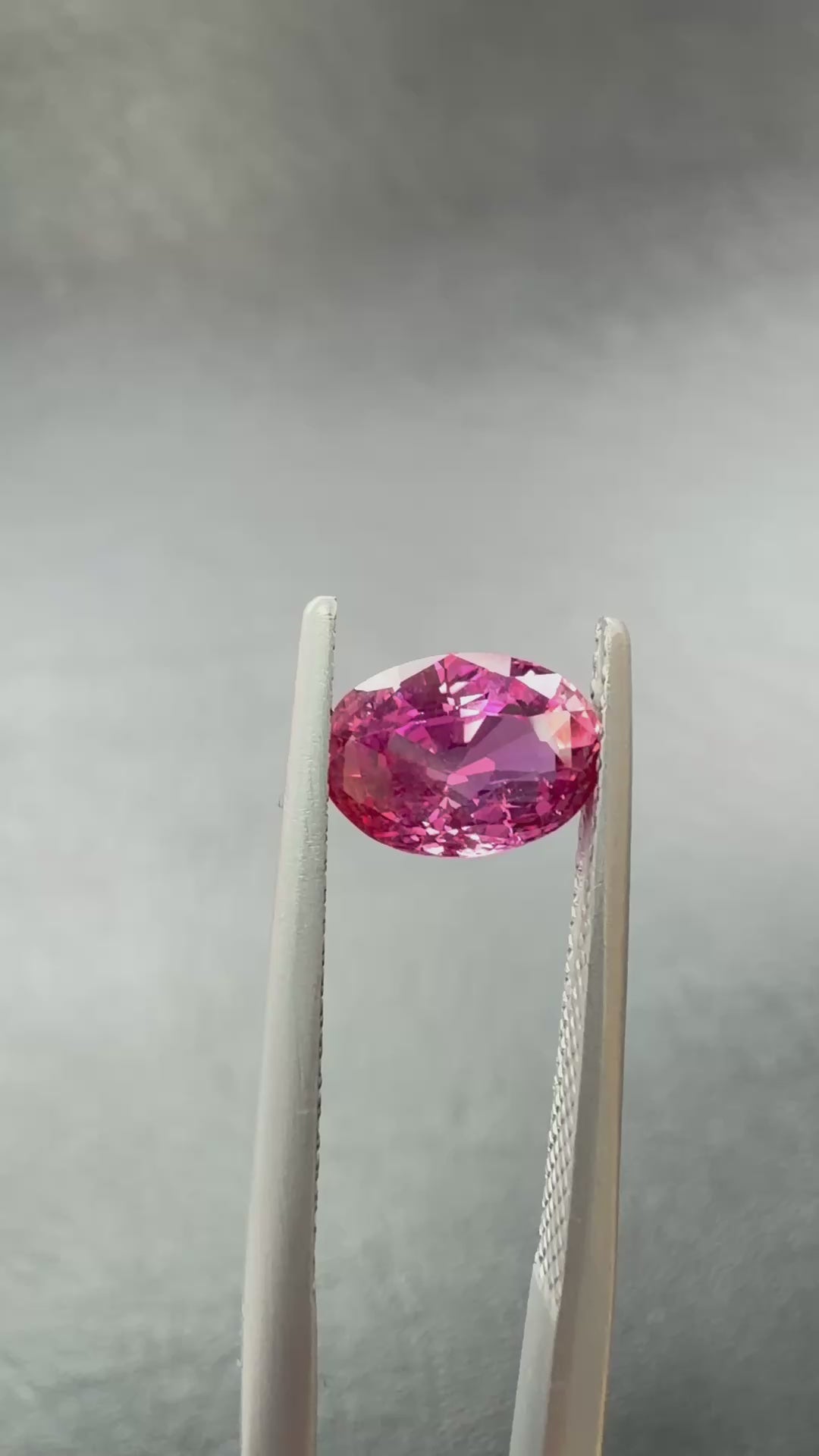 Natural 1.73ct Oval Orangy Pink Sapphire, video