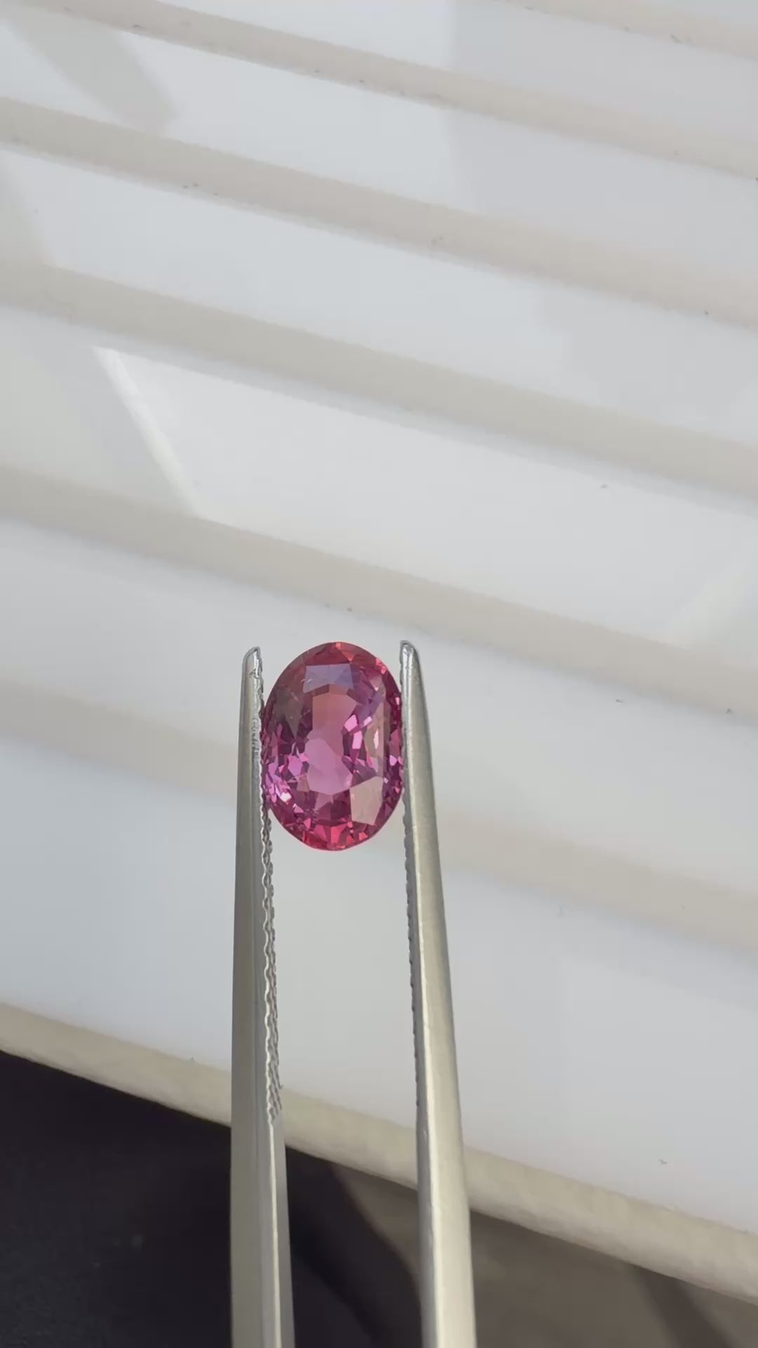 Natural 1.73ct Oval Orangy Pink Sapphire, video