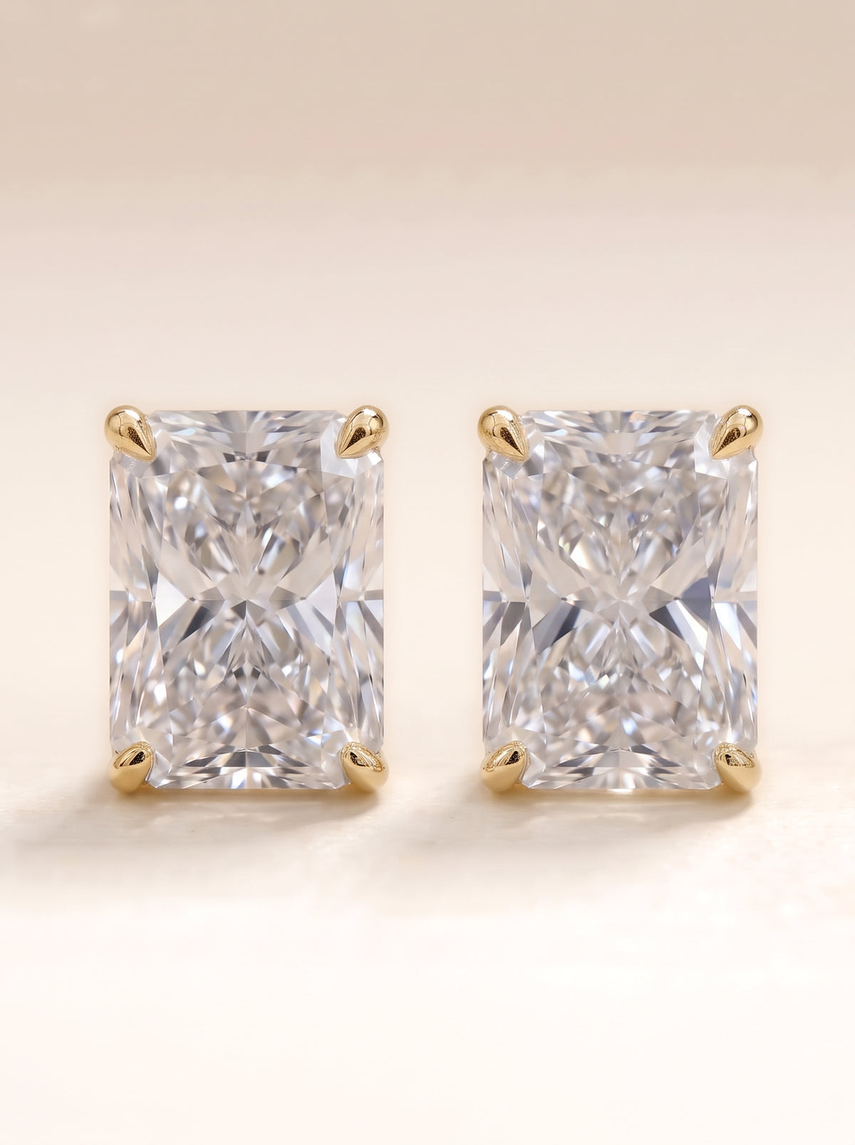 Radiant diamond stud earrings in 14K yellow gold