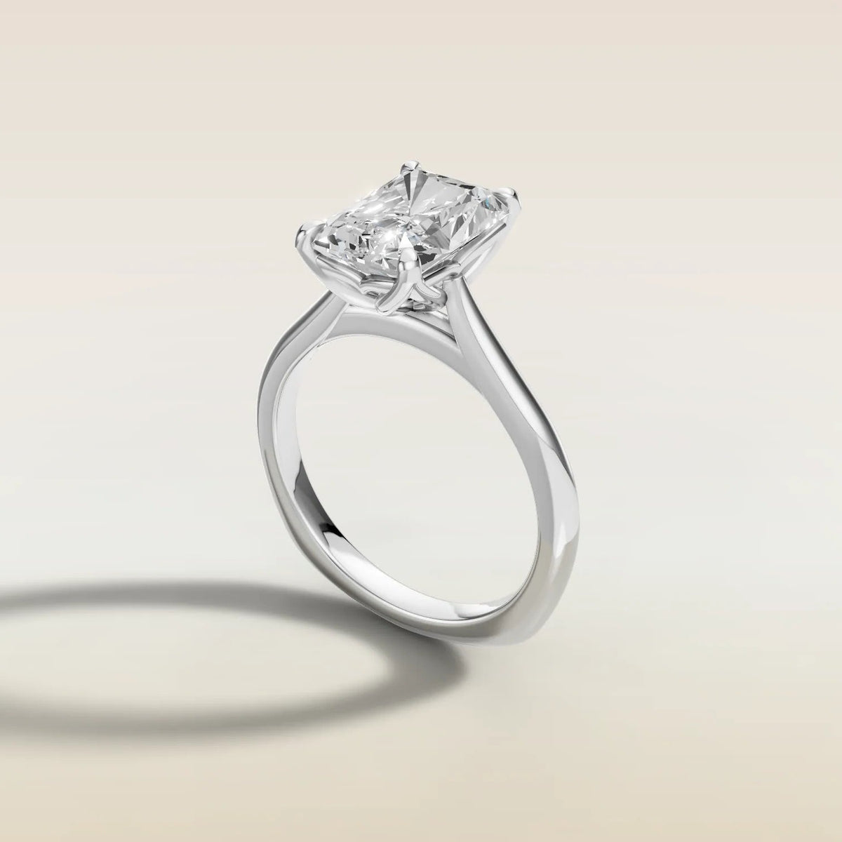 Radiant Tulip Curved Gallery Rail engagement ring in white gold, angled side view