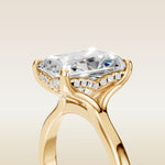Radiant Tulip Curved Hidden Halo Split Shank engagement ring in yellow gold, basket close up