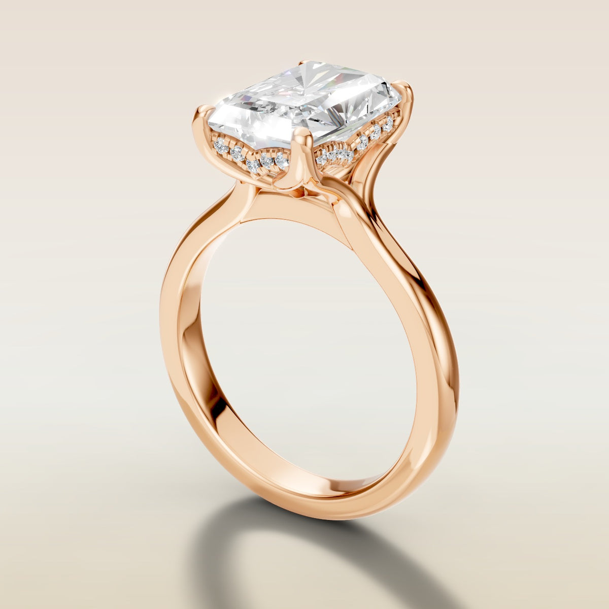Radiant Tulip Curved Hidden Halo Split Shank engagement ring in rose gold, angled side view