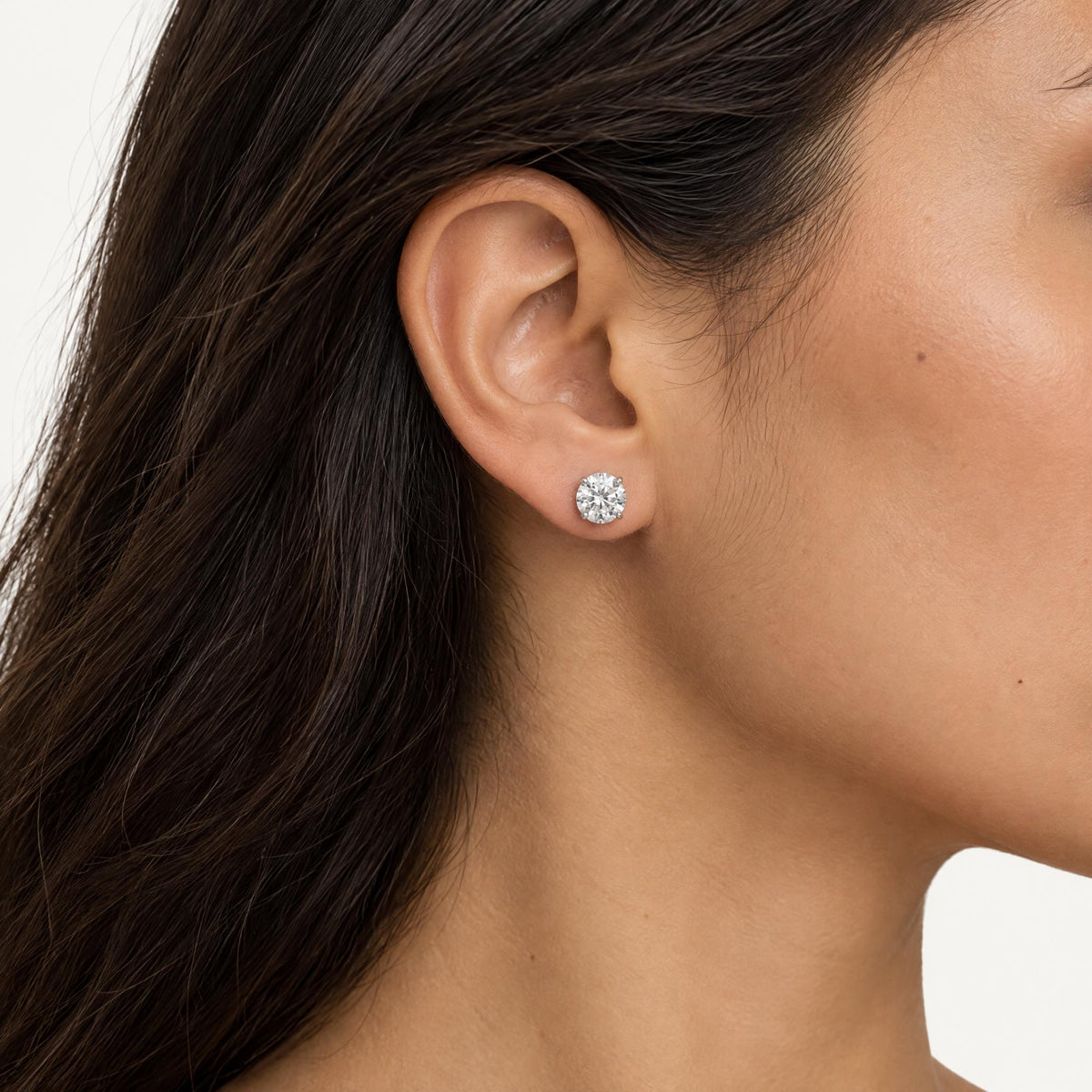 Round brilliant lab grown diamond stud earring worn on the ear