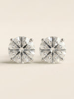 Round diamond stud earrings in 14K white gold