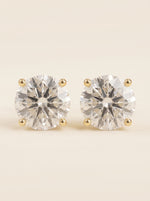 Round diamond stud earrings in 14K yellow gold
