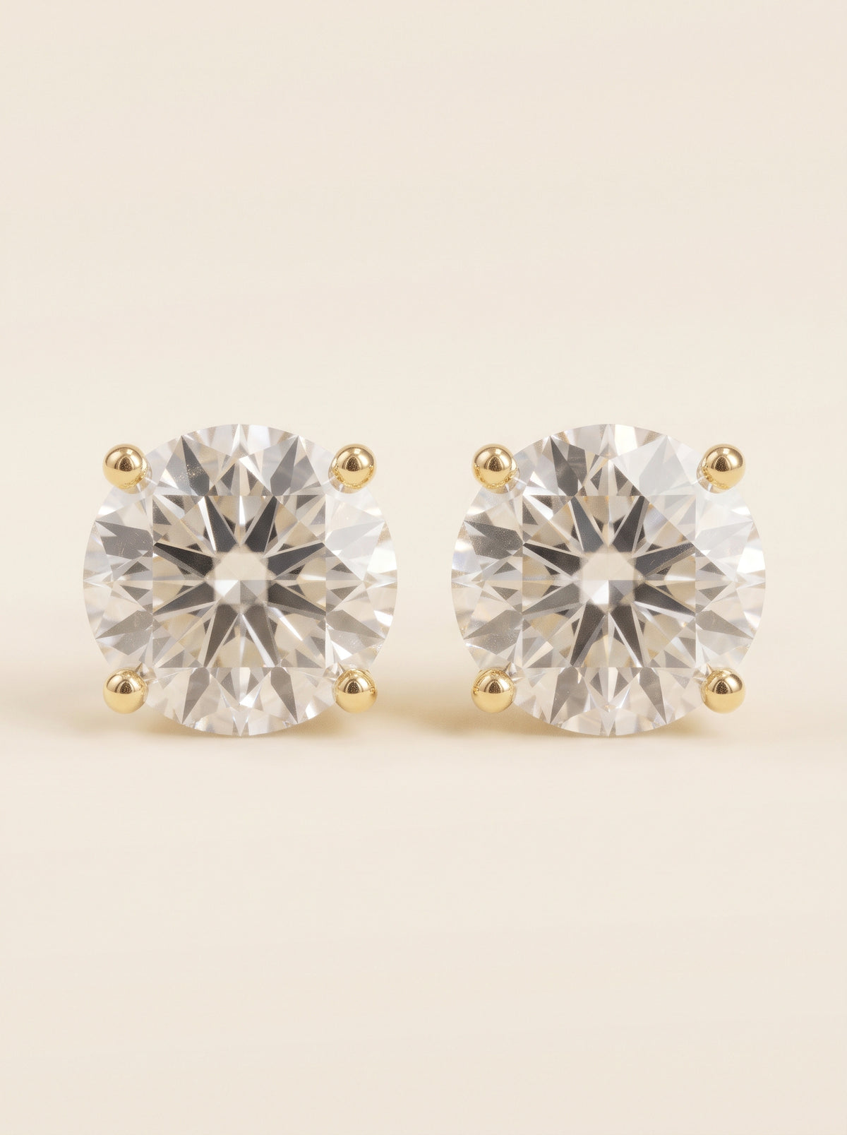 Round diamond stud earrings in 14K yellow gold