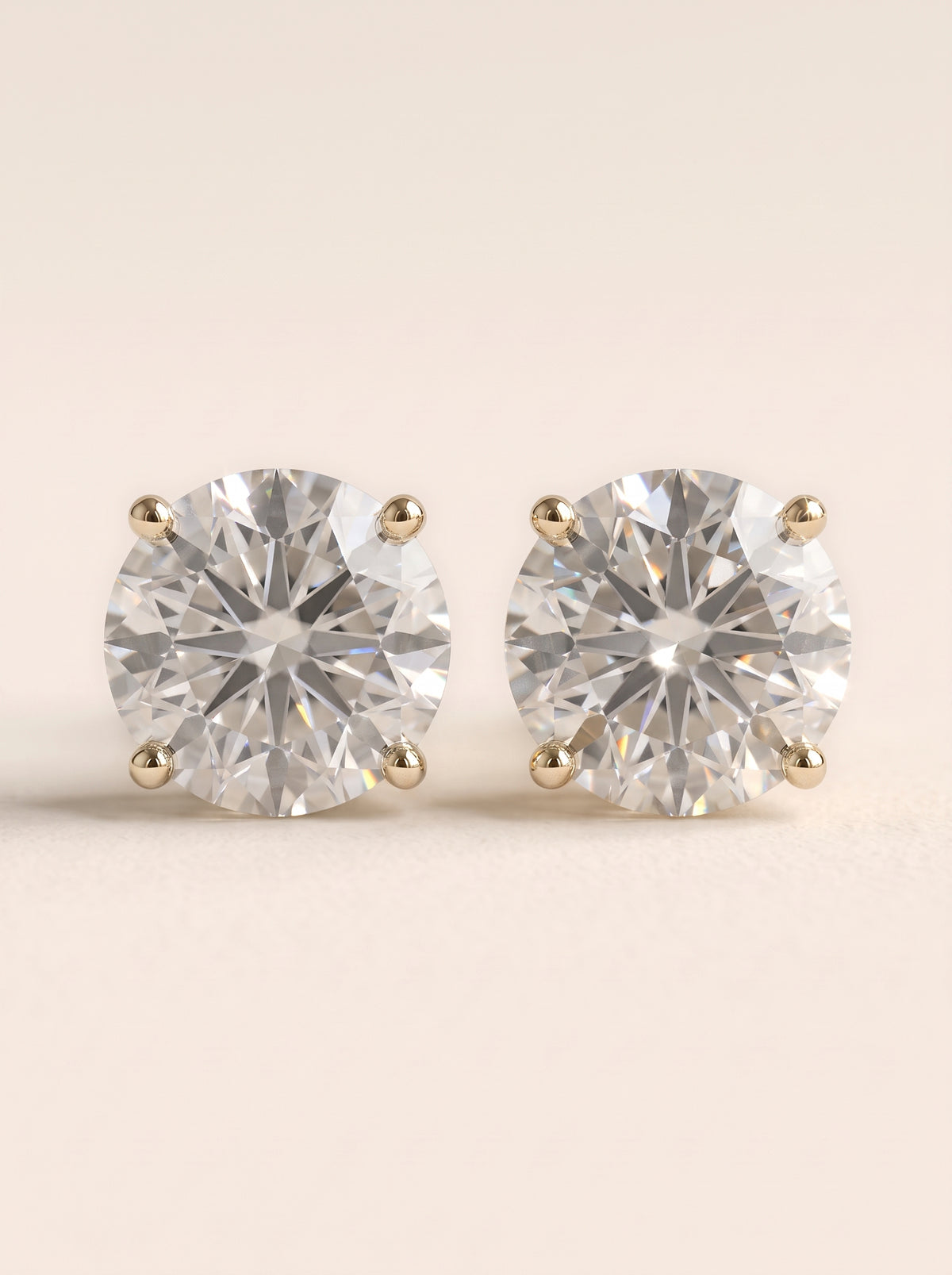 Round diamond stud earrings in 14K yellow gold
