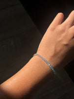 Tennis bracelet with lab grown diamonds worn on wrist