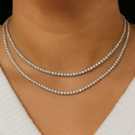 Tennis necklace with round lab grown diamonds worn on neck